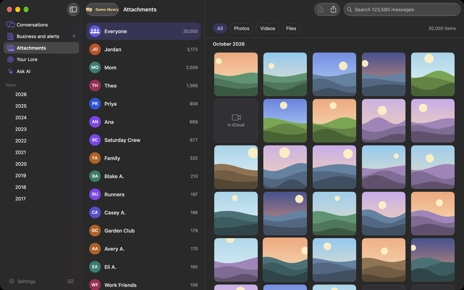 The Attachments page: 20,000 photos, videos and files, by person and by month. Dark appearance.
